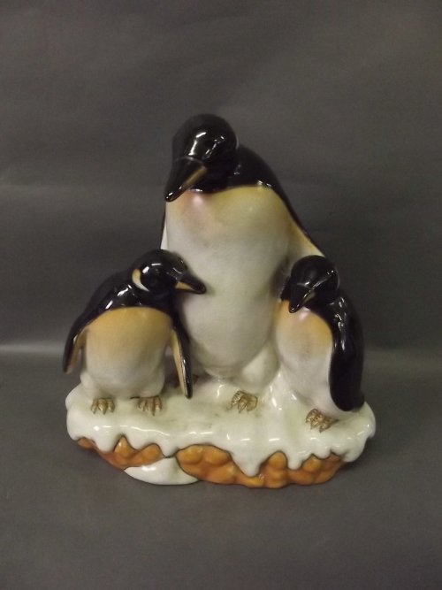 A continental pottery figure of a group of penguins, 11: A continental pottery figure of a group of penguins, 11'' high
