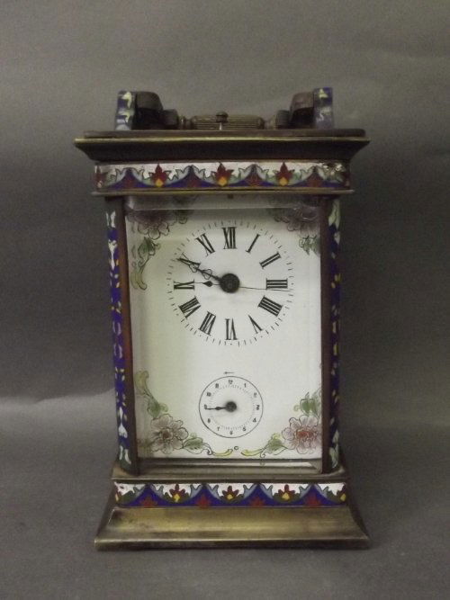 A cloisonne decorated carriage clock with twin dials an: A cloisonne decorated carriage clock with twin dials and flower decorated back plate (AF), 7'' high