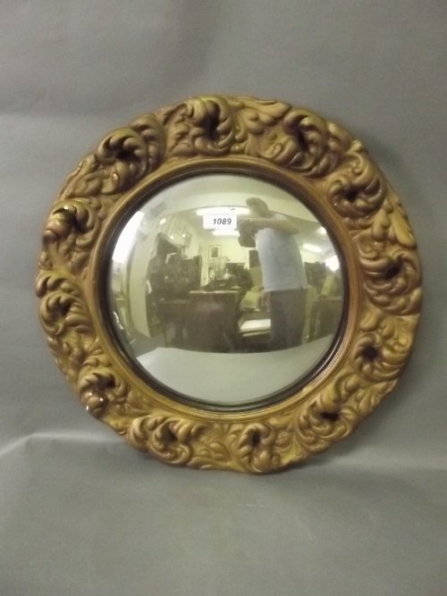 A gilt framed circular convex wall mirror, 17½'' diamet