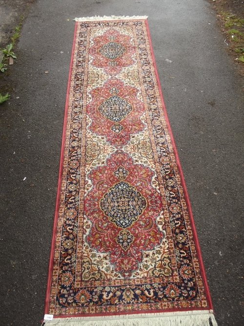 A C20th Persian silk runner with floral decoration, 111