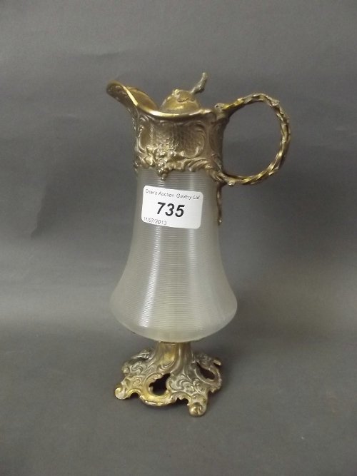 A C19th gilt metal mounted ribbed glass jug, 8'' high: A C19th gilt metal mounted ribbed glass jug, 8'' high