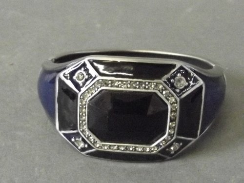 An Art Deco style blue and black bangle with inset: An Art Deco style blue and black bangle with inset white stones to front, 3'' wide