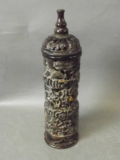 A Chinese pierced horn incense jar and cover with: A Chinese pierced horn incense jar and cover with carved decoration of dragons chasing flaming pearls and bats, 10¾'' x 2¾''