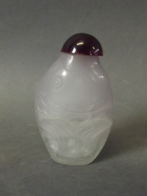 A Chinese glass snuff bottle moulded in the form of a: A Chinese glass snuff bottle moulded in the form of a fish, 2½'' long