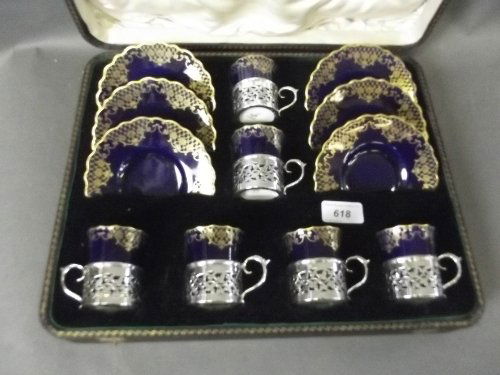 An Aynsley blue and gilt decorated cabaret set with: An Aynsley blue and gilt decorated cabaret set with Hallmarked silver mounts, Birmingham 1910/11, cased, retailed by Weir & Sons of Dublin, 14½'' wide