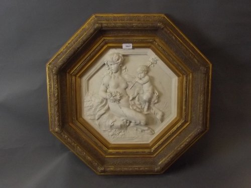 A large gilt framed octagonal plaster plaque carved in: A large gilt framed octagonal plaster plaque carved in the form of 2 fawns, 24'' x 24''