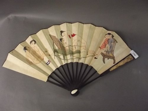 A Chinese hand painted erotic fan with carved and: A Chinese hand painted erotic fan with carved and silver wire inlaid decoration, 22½'' wide