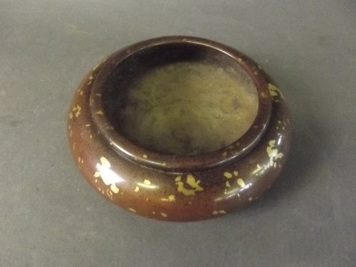 A Chinese circular bronze censer with gold splashed: A Chinese circular bronze censer with gold splashed decoration, seal mark to base, 4¾'' diameter
