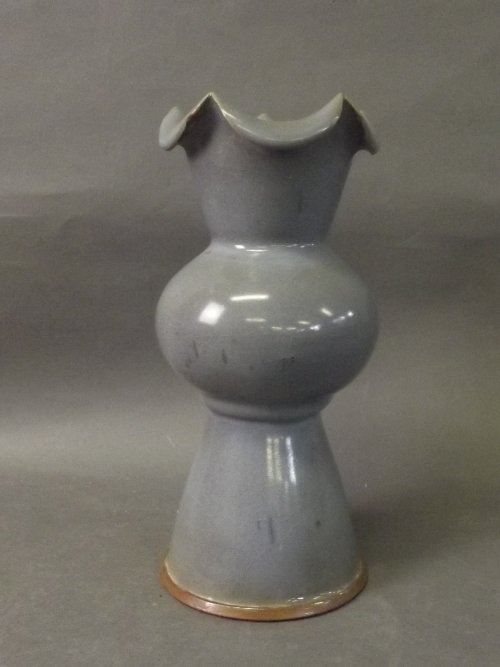 A Chinese blue ground pottery stem vase with frilled: A Chinese blue ground pottery stem vase with frilled rim, 8½'' high