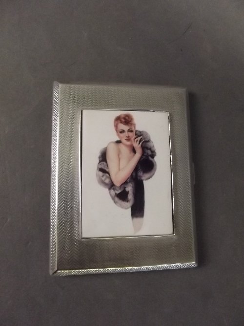 A Hallmarked silver cigarette case, Birmingham 1928/29,: A Hallmarked silver cigarette case, Birmingham 1928/29, the enamel front decorated with a maiden in furs, 4¼'' x 3 1/¼ 200g