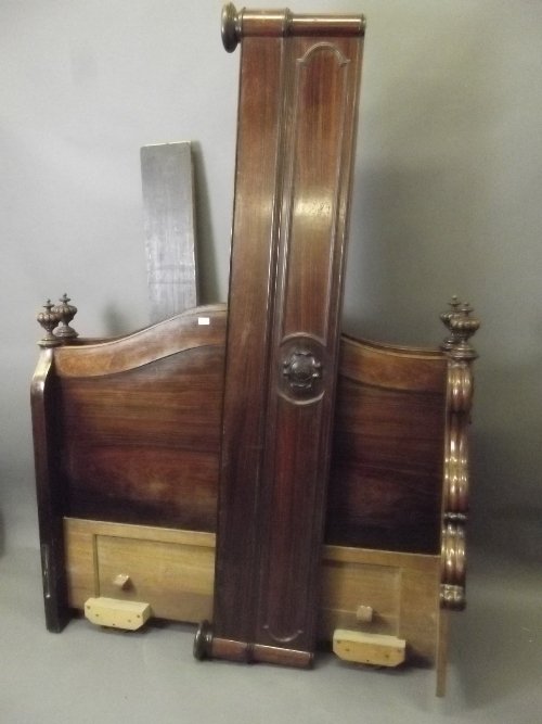 A good early C19th carved rosewood double bed frame: A good early C19th carved rosewood double bed frame with fluted finials, 57½'' x 82'', 47'' high