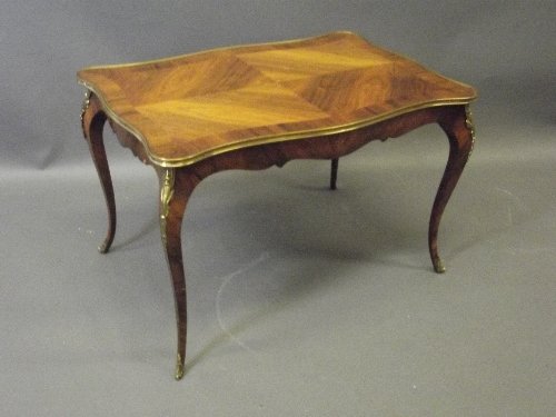 An early C20th French rosewood low table with brass: An early C20th French rosewood low table with brass mounts and cross banded top, 31'' x 20½'', 20'' high