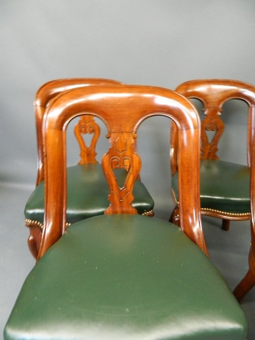 A good set of 4 mid Victorian carved mahogany library: A good set of 4 mid Victorian carved mahogany library chairs on cabriole supports