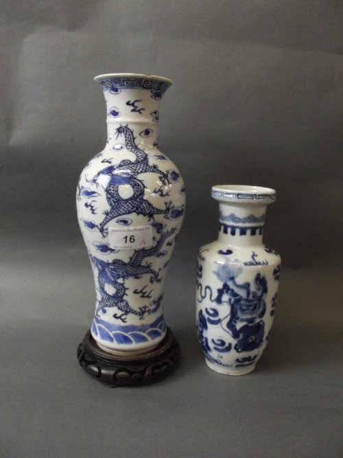 A C19th Chinese blue and white pottery vase painted: A C19th Chinese blue and white pottery vase painted with dragons, 4 character mark, 10'' high, and another painted with kylin