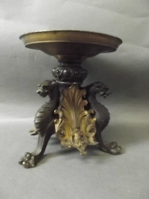 A good C19th continental bronze and gilt bronze stand: A good C19th continental bronze and gilt bronze stand decorated with griffin, 7¼'' high