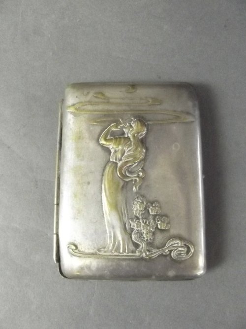 A C19th continental Art Nouveau silver plated cigarette: A C19th continental Art Nouveau silver plated cigarette case decorated with a maiden smoking, 4'' x 3''