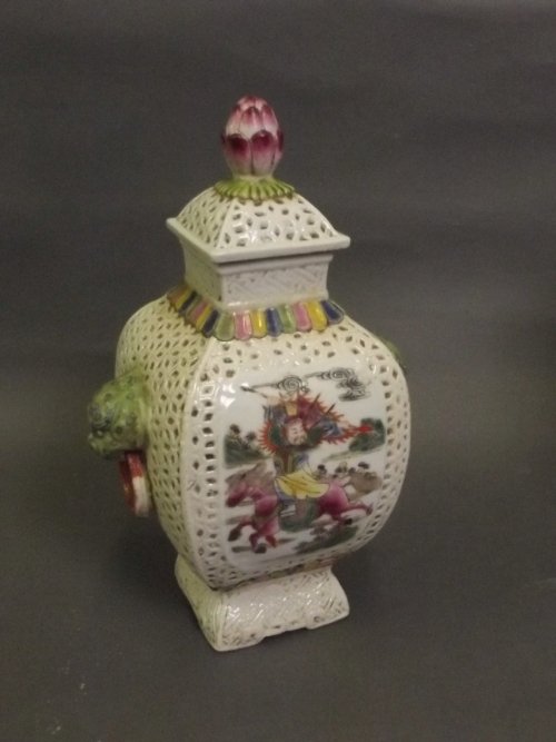 A Chinese jar and cover with twin loop dragon head: A Chinese jar and cover with twin loop dragon head handles and polychrome enamel panels depicting warriors on horseback, stamp mark to base, 8'' high