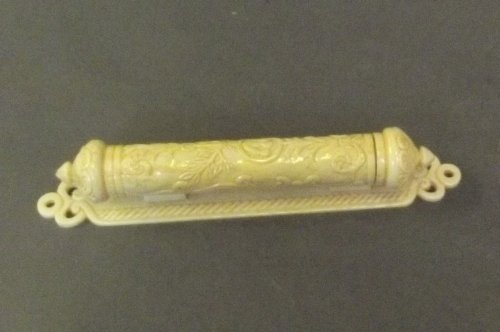 A small carved bone Jewish scroll holder mounted on a: A small carved bone Jewish scroll holder mounted on a stand, 7'' long