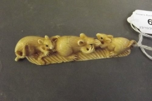 A Japanese carved ivory netsuke in the form of 3 rats: A Japanese carved ivory netsuke in the form of 3 rats on a leaf, 3½'' wide
