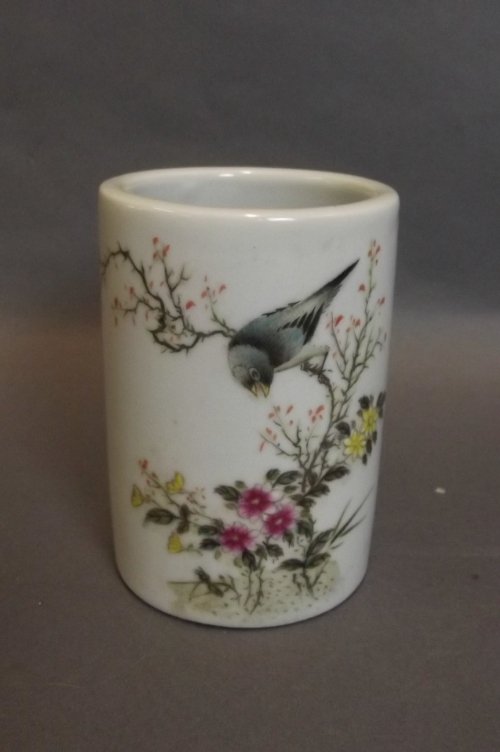 A small Chinese brush pot with painted enamel decoratio: A small Chinese brush pot with painted enamel decoration of a bird perched on a flowering tree, inscription verso, 4¼'' x 3''