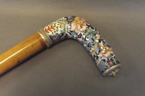 A walking stick with a Russian silver and Champlevé ena: A walking stick with a Russian silver and Champlevé enamel handle, 37'' long