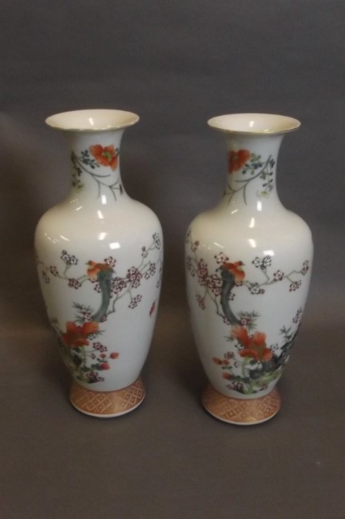 A pair of Chinese pottery vases painted in polychrome e: A pair of Chinese pottery vases painted in polychrome enamels with birds and flowers, seal mark to base, 12'' high