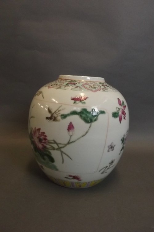 A C19th Chinese pottery jar painted in coloured enamels: A C19th Chinese pottery jar painted in coloured enamels with flowers etc, 7'' high