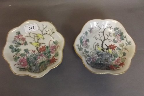 A pair of Chinese C19th shaped pottery dishes painted i: A pair of Chinese C19th shaped pottery dishes painted in coloured enamels with birds, flowers, and rock work, seal mark to base, 6¾'' diameter