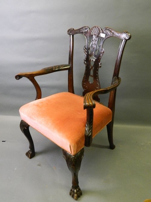 A good C19th mahogany Chippendale style carved elbow ch: A good C19th mahogany Chippendale style carved elbow chair with bold carved decoration and pierced splat, standing on cabriole supports with claw feet