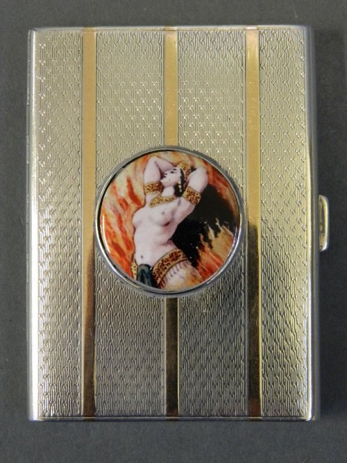 A silver cigarette case with gold bands and applied: A silver cigarette case with gold bands and applied plaque of a nude dancer to front, Birmingham 1927, 3Â½'' long