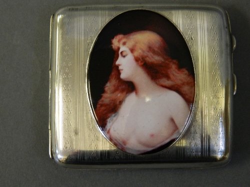 A silver cigarette case with an applied enamel of a: A silver cigarette case with an applied enamel of a nude, Birmingham 1916, 3Â½'' long