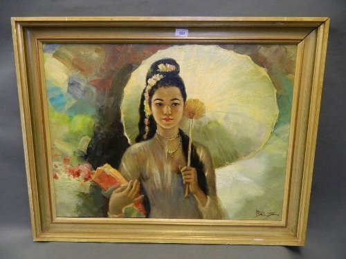 A large oil on canvas, portrait of an Indonesian maiden: A large oil on canvas, portrait of an Indonesian maiden with parasol, signed indistinctly, in a gilt frame, image 31'' x 23''