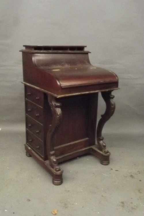 A Victorian style mahogany rising top davenport with: A Victorian style mahogany rising top davenport with fitted interior and writing slope, 21Â½'' x 22Â½'', 36'' high (AF)
