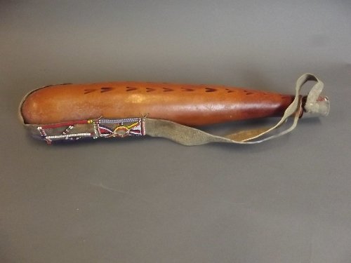 An American Indian leather water gourd with bead work: An American Indian leather water gourd with bead work decoration, 18½'' long
