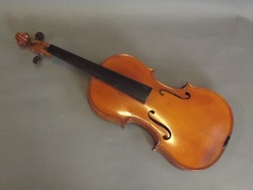 A violin labelled 'Les fils de J. Tournier, No.306,: A violin labelled 'Les fils de J. Tournier, No.306, 1924', 23'' long