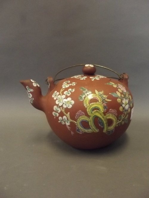 A large Chinese Yixing pottery shaped teapot with: A large Chinese Yixing pottery shaped teapot with enamelled decoration depicting flowers, 5½'' high