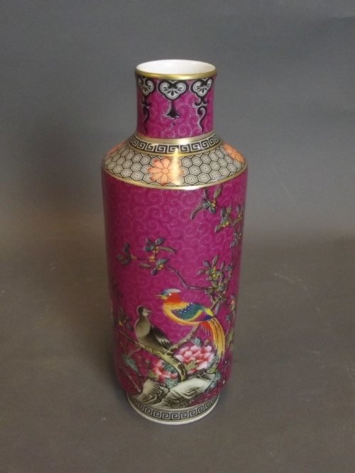 A Chinese magenta ground stem vase decorated with birds: A Chinese magenta ground stem vase decorated with birds perched on a branch, 4 character mark to base, 7½'' high