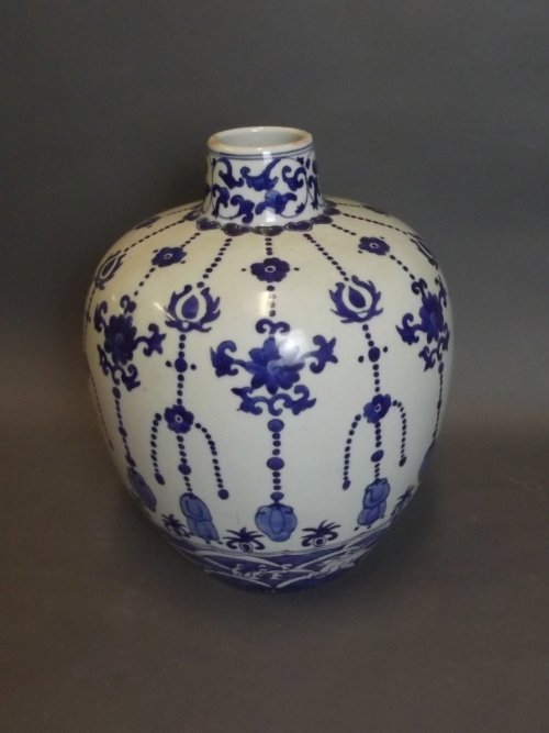A Chinese blue and white bulbous vase with cascading: A Chinese blue and white bulbous vase with cascading floral decoration and prancing deer to side, 9¾'' high