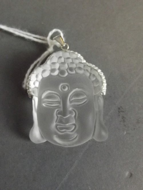 An opaque glass and silver 925 mounted pendant in the: An opaque glass and silver 925 mounted pendant in the form of Buddha's head, 1¼'' x 1''