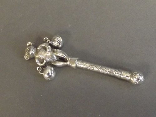 A silver child's rattle in the form of a bear, 4½'': A silver child's rattle in the form of a bear, 4½'' long