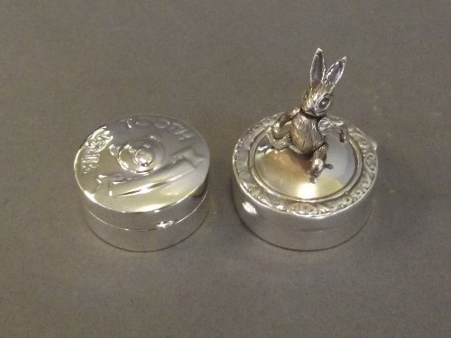 Two Continental silver 'First Tooth' boxes, one with a: Two Continental silver 'First Tooth' boxes, one with a figure of a hare with articulated head to lid, the other with embossed teddy