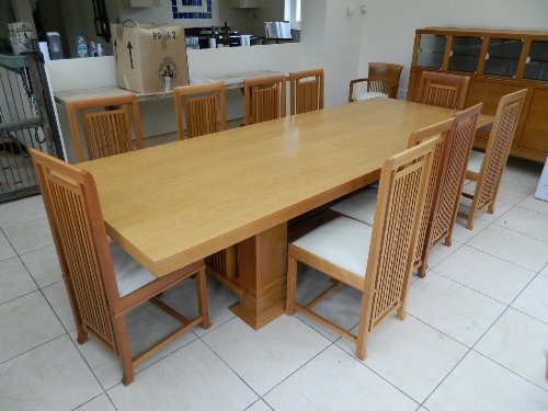 A large cherrywood refectory dining table designed by: A large cherrywood refectory dining table designed by Frank Lloyd Wright, made by Cassini by license in Italy, 110'' x 42'', 28'' high
