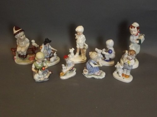 A quantity of assorted Continental porcelain figures of: A quantity of assorted Continental porcelain figures of children with various animals, largest 6½'' high