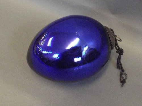 An old blue glass ovoid shaped Christmas decoration,: An old blue glass ovoid shaped Christmas decoration, 6½'' long