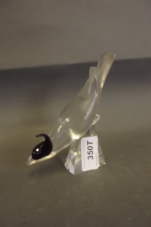A Lalique glass ring stand in the form of a bird,: A Lalique glass ring stand in the form of a bird, signed, 5'' high (AF), Best Bid