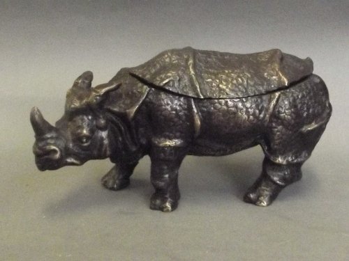 A bronze inkwell in the form of a standing rhino, 6½'': A bronze inkwell in the form of a standing rhino, 6½'' long