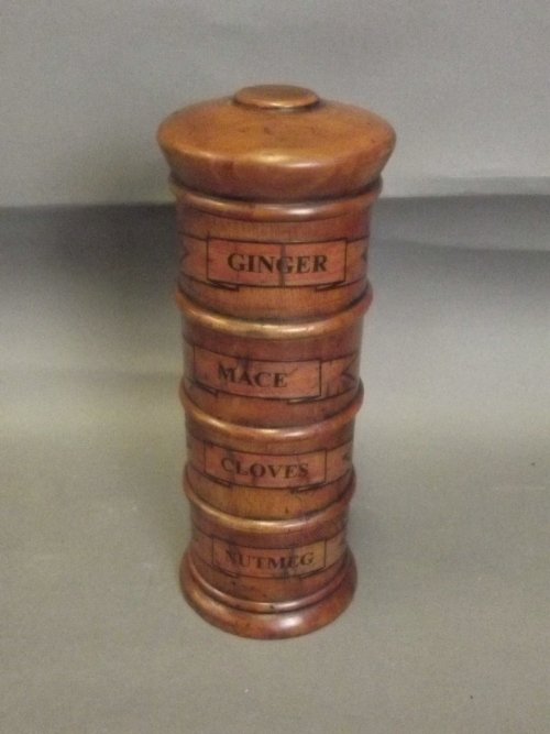 A treen four section spice tower for ginger, mace,: A treen four section spice tower for ginger, mace, garlic and nutmeg, 8'' high