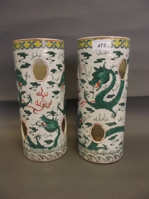 A pair of C19th Chinese famille verte pottery: A pair of C19th Chinese famille verte pottery reticulated vases painted with dragons etc, 11'' high (AF hairline cracks)