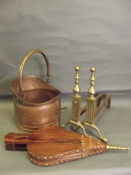 A pair of brass fire dogs, a pair of bellows, and a: A pair of brass fire dogs, a pair of bellows, and a coal bucket, 21'' long