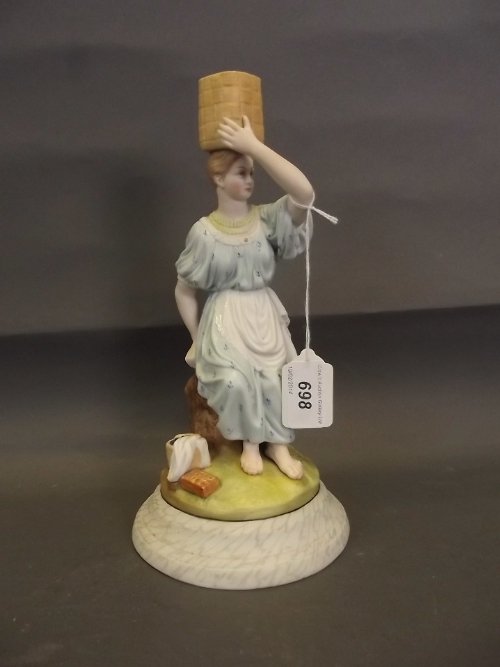 A Russian Gardner factory bisque figure of a seated: A Russian Gardner factory bisque figure of a seated girl holding a basket on her head, 10'' high